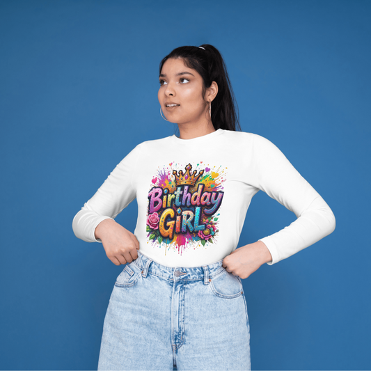 Person wearing a white long-sleeve shirt with 'Birthday Girl' design on a blue background